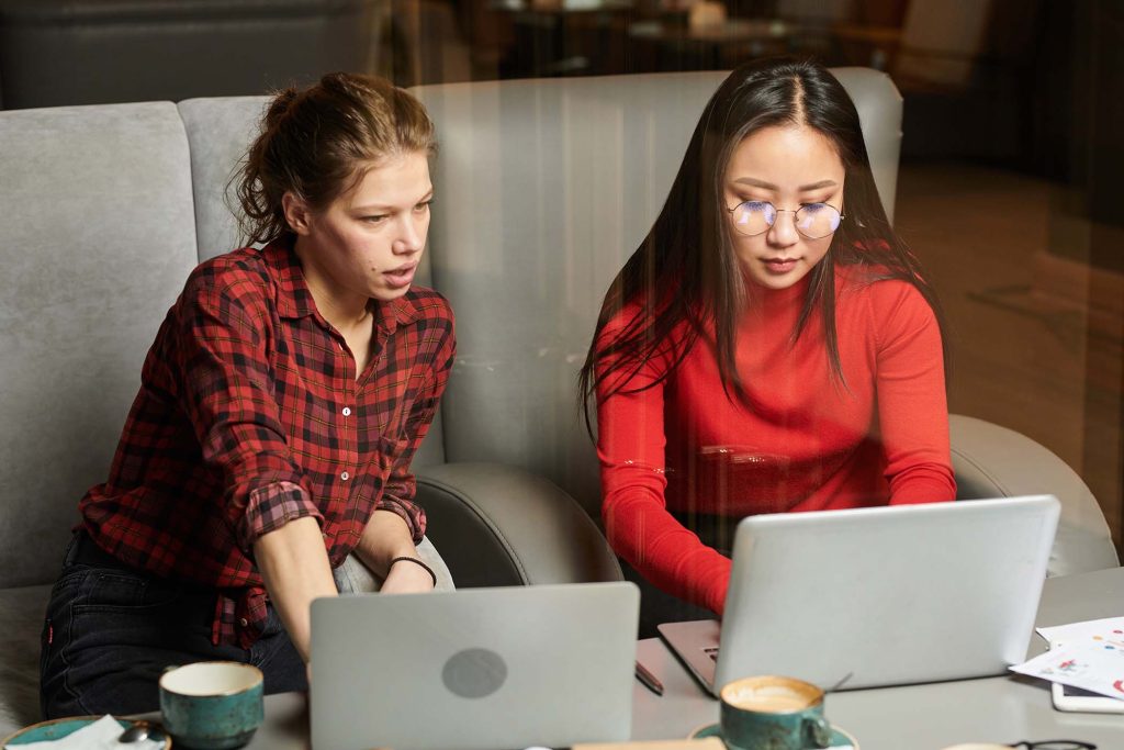 businesswomen-working-on-laptop-JNFP9SD.jpg