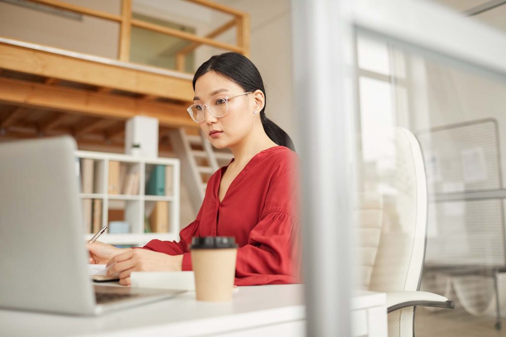 modern-asian-businesswoman-using-laptop-FKNTVAT.jpg